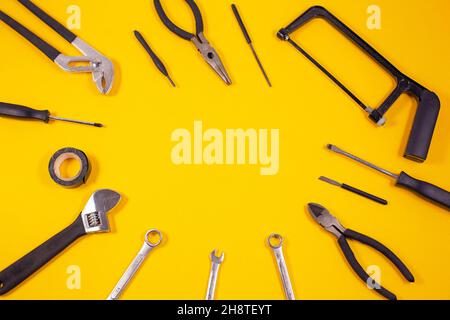Construction tools for repairs Various carpentry on yellow background. Top view with space for text. Stock Photo