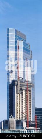Number 8 Bishopsgate skyscraper under construction, November 2021, city of london, England, in front of 22 Bishopsgate (aka twentytwo) skyscraper. Stock Photo