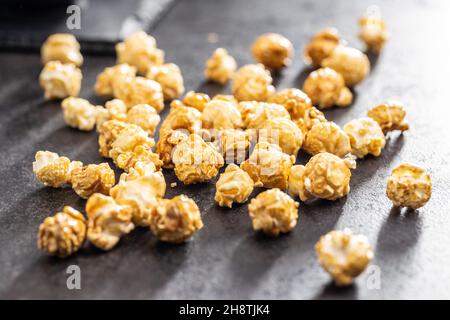Sweet caramel popcorn on table. Stock Photo