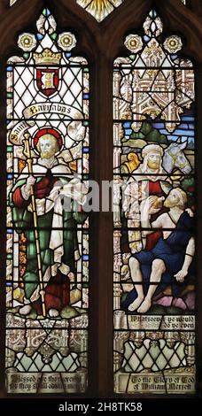 A stained glass window by Robert Newbery depicting St Barnabas and The Good Smaritan, St Mary's Church, Usk, Monmouthshire Stock Photo