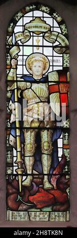 Stained glass window of 1921 by Percy Bacon depicting St George, St James Church, Shere, Surrey. Dedicated to the fallen of the parish Stock Photo