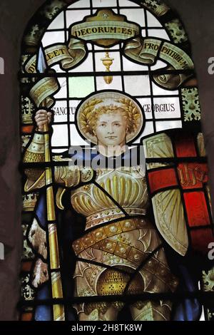 Stained glass window of 1921 by Percy Bacon depicting St George, St James Church, Shere, Surrey. Dedicated to the fallen of the parish Stock Photo