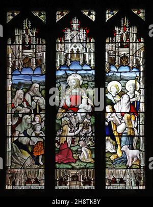 Stained glass window of 1892 by Percy Bacon & Brothers depicting Jesus with children, St Michael & All Angels Church, Mickleham, Surrey Stock Photo