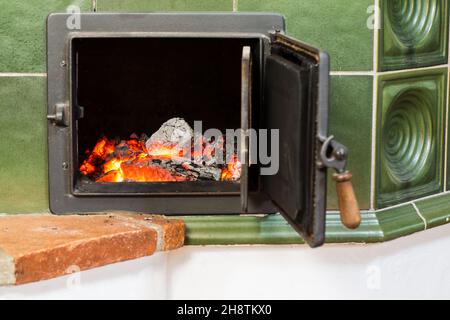 Embers in the fireplace before closing Stock Photo
