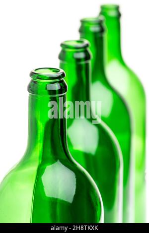 Green bottles standing in a row on white background Stock Photo