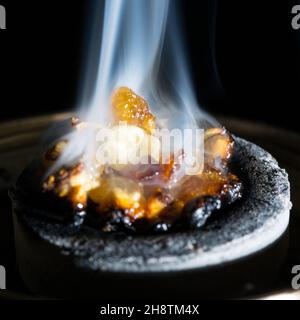 Smoking Incense on Charcoal Stock Photo