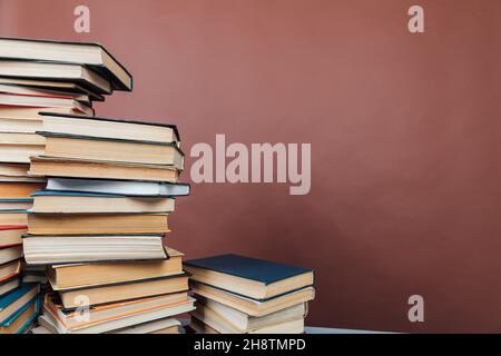 lots of books to study in the university library on a brown background Stock Photo