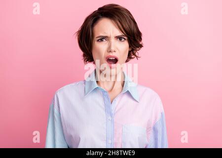 Photo portrait woman amazed unhappy dissatisfied angry isolated pastel pink color background Stock Photo