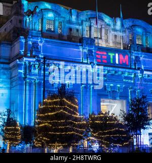 Audiovisual projection at night on the façade of the Central Station in Milan during Christmas. Stock Photo