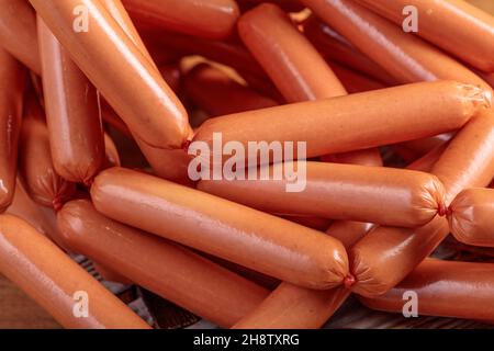 bunch of sausages in a bunch. Natural casing filled with minced meat. Stock Photo
