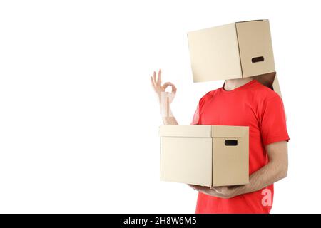 Delivery man with a box on his head and in the hand, isolated on white background Stock Photo