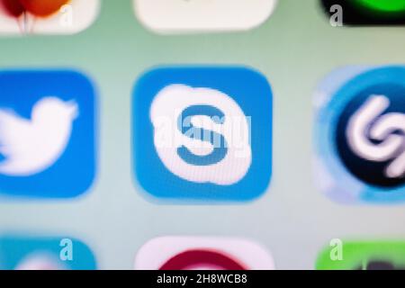 In this photo illustration a close-up of a Skype app icon seen displayed on a smartphone screen. Stock Photo