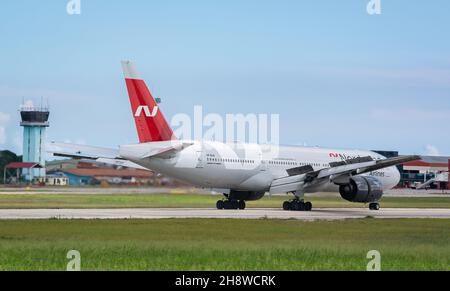 MATANZAS, CUBA - Sep 25, 2021: The Nordwind Airlines Boeing 777-200 in the airport of Varadero, Cuba on blue sky background Stock Photo