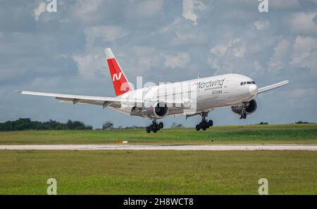 MATANZAS, CUBA - Sep 25, 2021: The Nordwind Airlines Boeing 777-200 in the airport of Varadero, Cuba on blue sky background Stock Photo