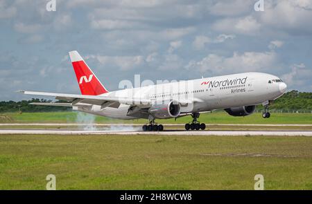 MATANZAS, CUBA - Sep 25, 2021: The Nordwind Airlines Boeing 777-200 in the airport of Varadero, Cuba on blue sky background Stock Photo