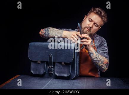 Professional Tanner creates a new leather product Stock Photo
