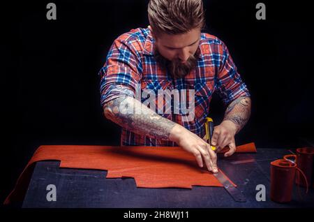 Worker of leather making quality products Stock Photo