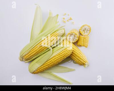 Fresh sweet corn on cobs on white background, closeup, top view Stock Photo