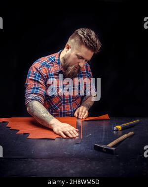 Currier manufacturing new leather product Stock Photo