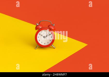 Red alarm clock on color background Stock Photo