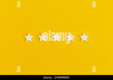 Five 5 stars, best excellent services rating on yellow background. Stock Photo