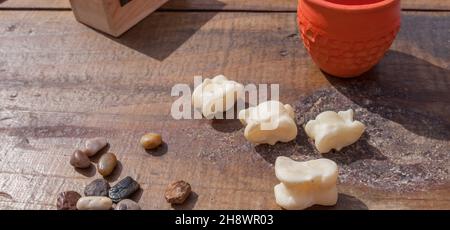 Reconstruction of roman board game knucklebones. Recreational activity of ancient romans Stock Photo