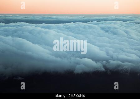 Breathtaking view of sundown sky with fluffy clouds illuminated by sun Stock Photo