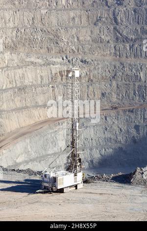 Blasthole drill in an open pit copper mine operation in Chile Stock Photo