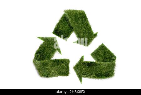 Symbol for eco recycling and environmentally friendly waste treatment from green grass isolated on white background Stock Photo
