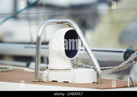 Details of stainless steel air intake on a teak deck of a luxury sailing yacht. Close-up of cowl ventilators for furnishing fresh air to compartments Stock Photo