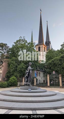 Vertical shot of the statue of Grand Duchess Charlotte near the Notre-Dame Cathedral in Luxembourg Stock Photo