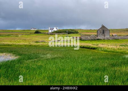 Tresta Kirk next to Papil Water on Fetlar in the Shetland Islands. Stock Photo