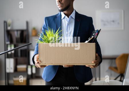 Fired Employee With Box. Unemployed Businessman Moving Stock Photo