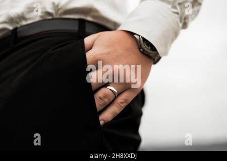 Detail of a wedding ring on hands during the big day, love is in the air Stock Photo