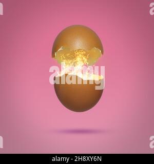 Egg shell broken into halves with a flame inside. Egg surprise concept. Stock Photo