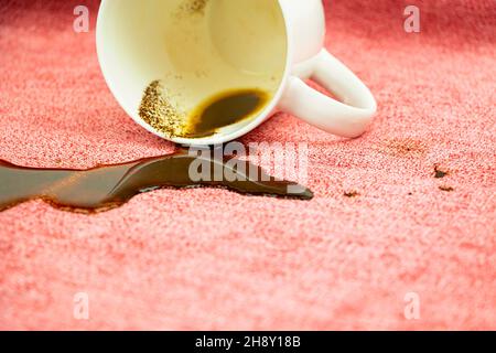 A stain on a light fabric, tablecloth, sofa. Washing, cleaning the fabric from stains Stock Photo