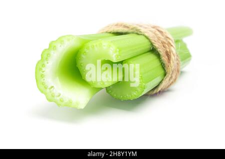 Bundle of fresh green celery stems isolated on white background cutout Stock Photo