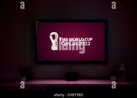 Doha, Qatar - December 02, 2021: A smart TV with the 2022 Fifa World Cup logo in the screen. Stock Photo