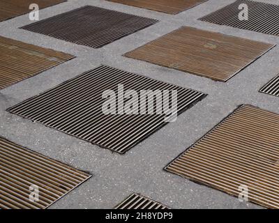 manhole cover grid useful as an industrial background Stock Photo