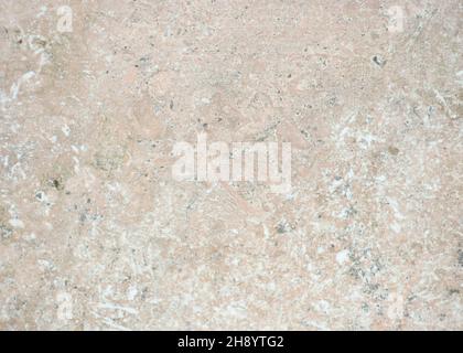 Pale pink marble, polished flat surface of natural stone with chipped surface close-up. Background, pattern, texture. Stock Photo