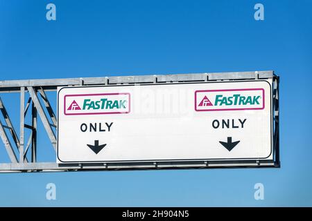 FasTrak Only express lane road sign. FasTrak is an electronic toll collection ETC system on toll roads, bridges, and high-occupancy toll lanes in Cali Stock Photo