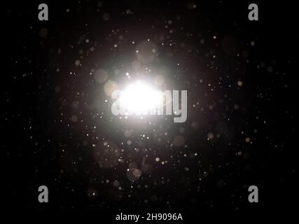 Munich, Germany. 03rd Dec, 2021. Snowflakes fly through the air in front of a streetlight. Credit: Sven Hoppe/dpa/Alamy Live News