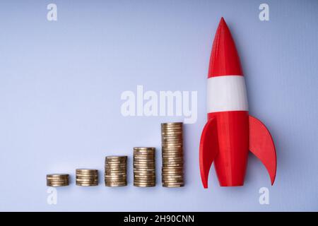 Rocket Upward Money Increase, Coin Stack Graph Stock Photo