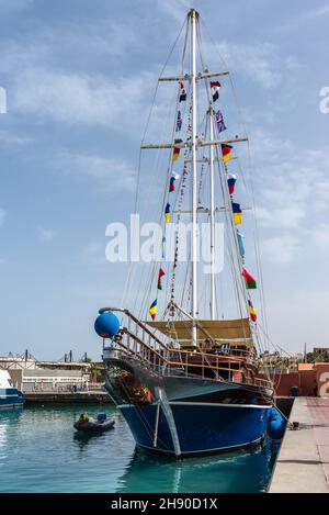 Hurghada, Egypt - May 31, 2021: The Pirate ship made into the restaurant at the Hurghada marina. Old sailing ship in the sea harbor of Hurghada, Egypt Stock Photo