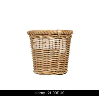 A rustic-style wicker basket on a natural wood chair surrounded by a ...