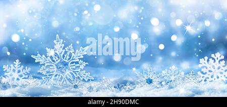 Snowflakes On Snow - Christmas And Winter Background - Natural Snowdrift Close Up With Abstract Light Stock Photo