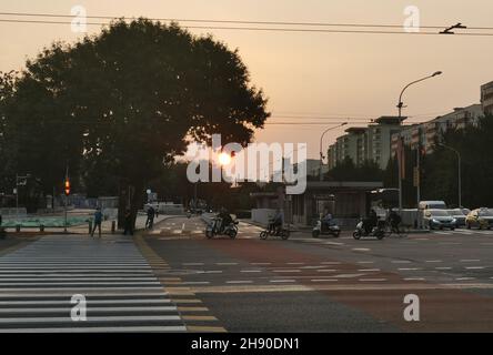 Beijing, China. 18th Sep, 2021. Photo taken with a mobile phone shows sunrise in Xicheng District of Beijing, capital of China, Sept. 18, 2021. Credit: Xu Liang/Xinhua/Alamy Live News Stock Photo