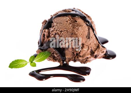 ice cream: A scoop of chocolate ice cream with chocolate sauce and mint Stock Photo
