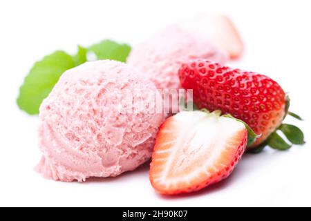 Two scoops of strawberry ice cream with strawberries isolated on white background Stock Photo