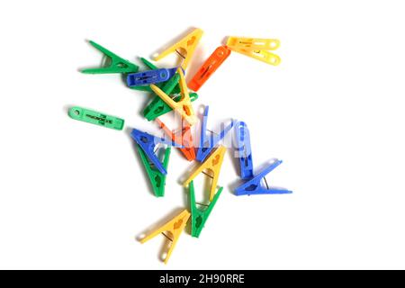 Multicolored clothespins on a white background, isolate Stock Photo